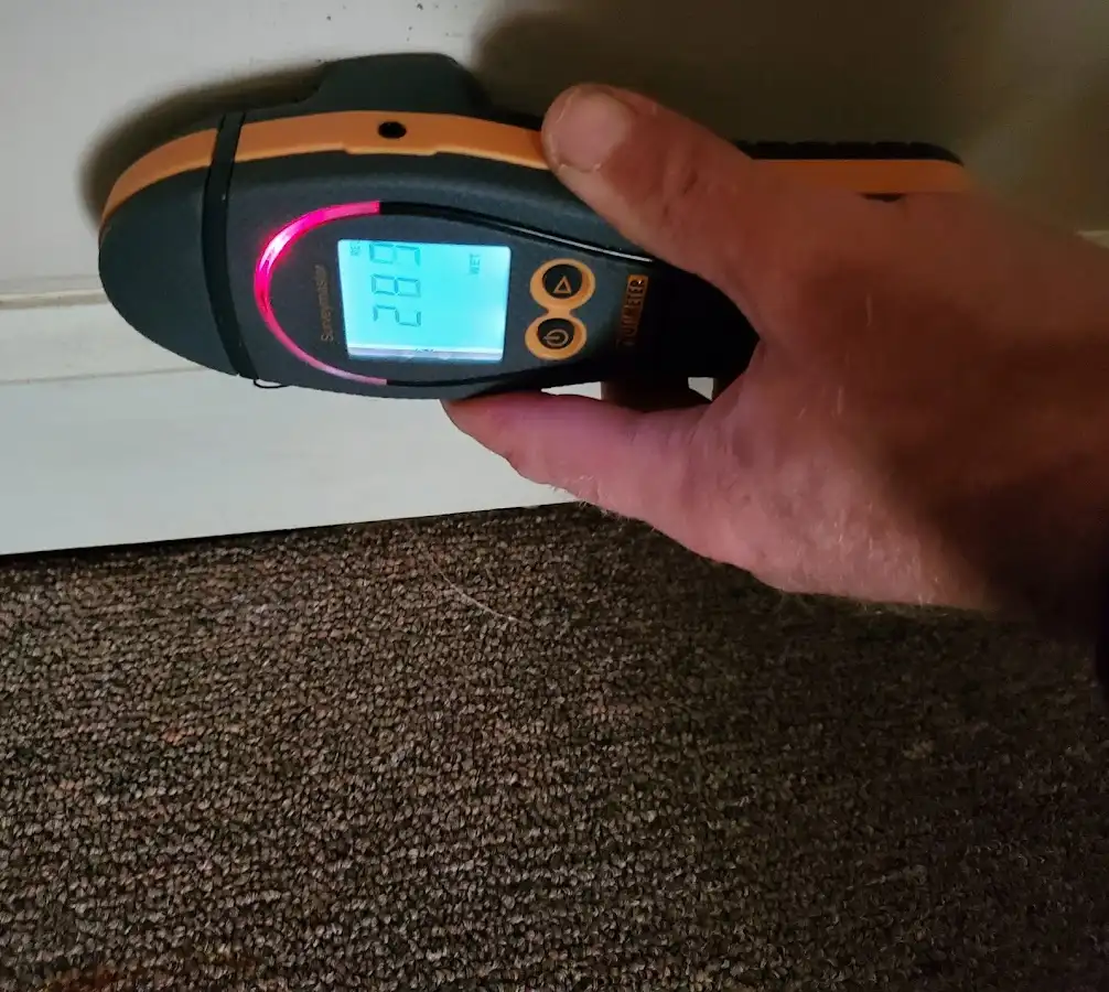 Moisture detection at baseboard during Sewage Cleanup & Sanitation in Beckett Ridge
